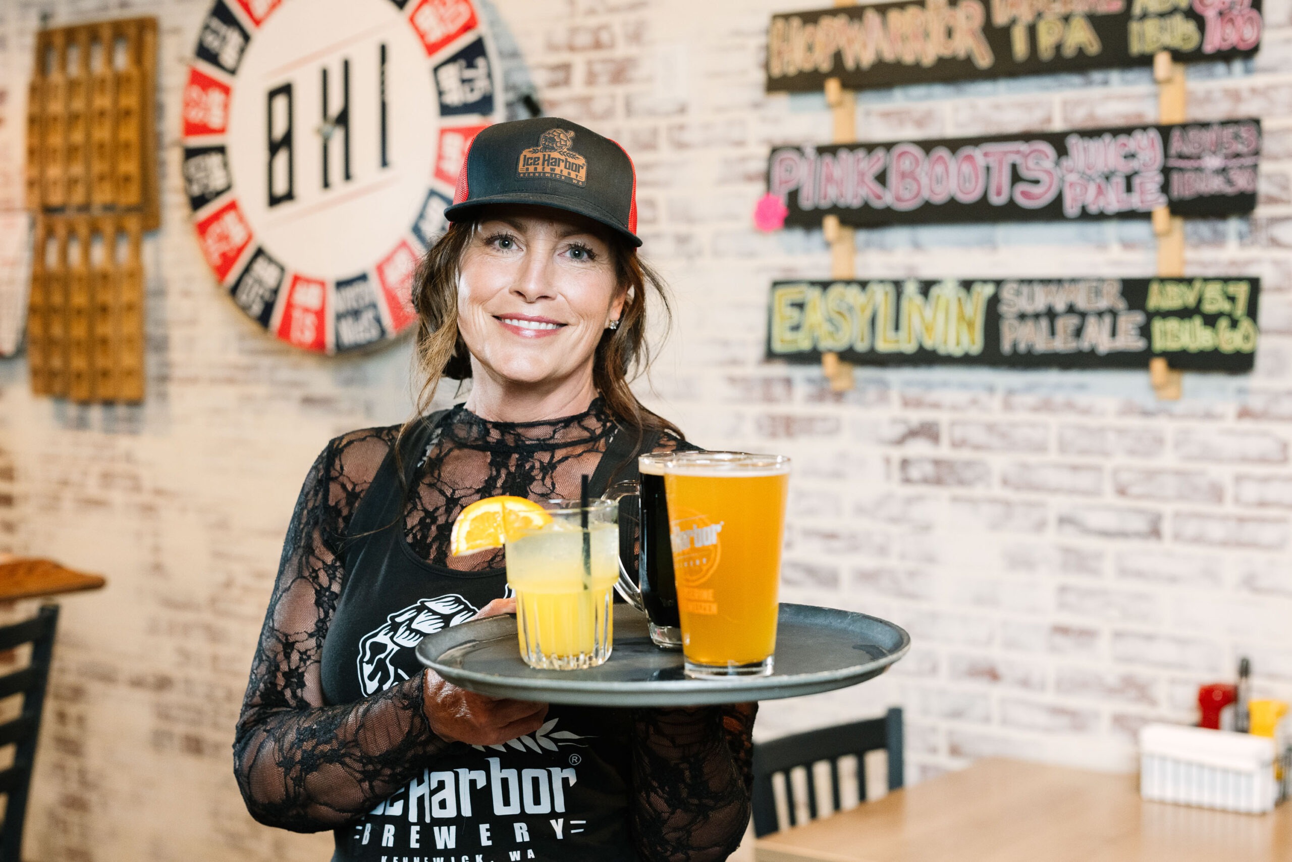 Ice Harbor bartender carrying a tray of drinks